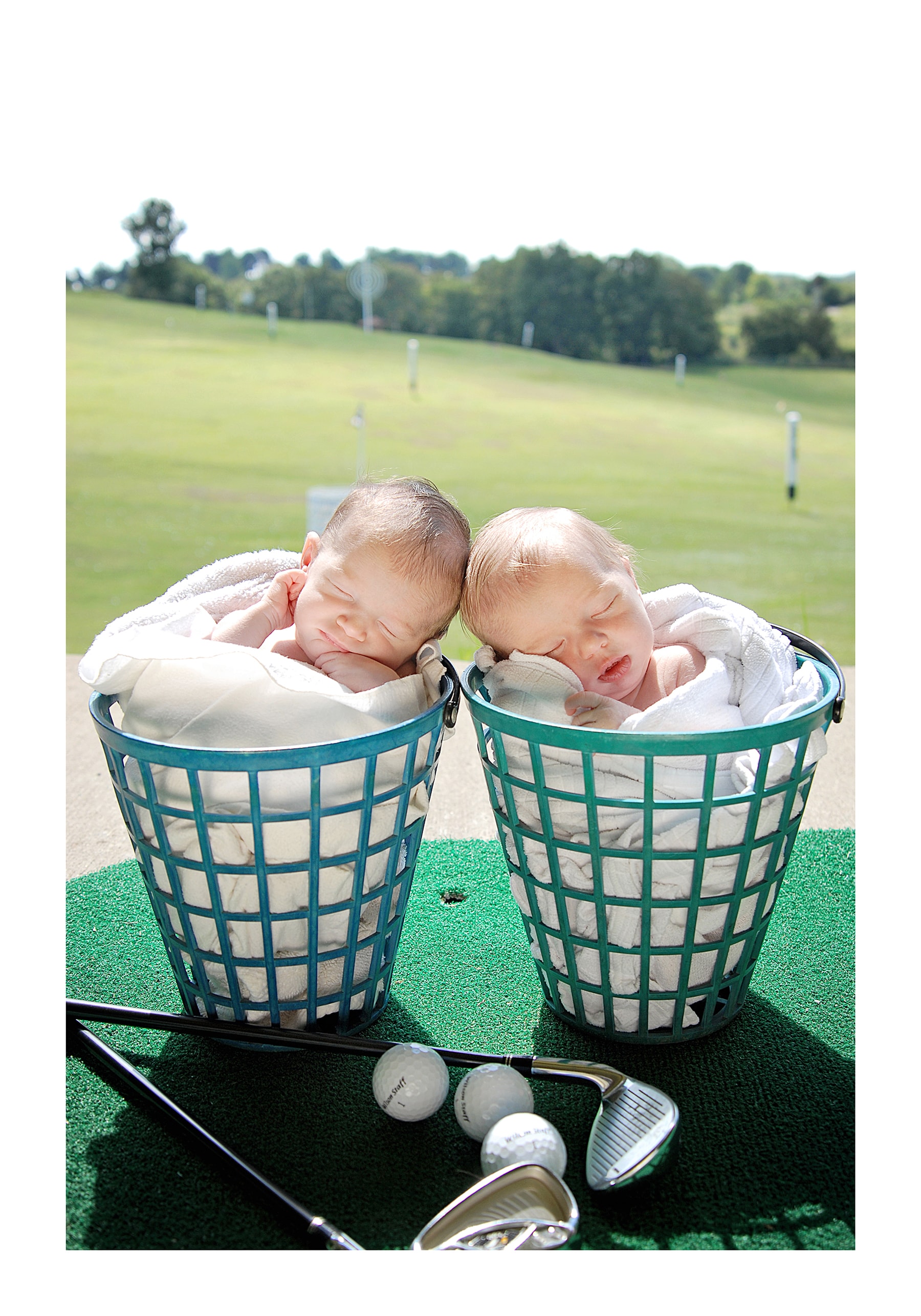 Twin babies in golf baskets on course