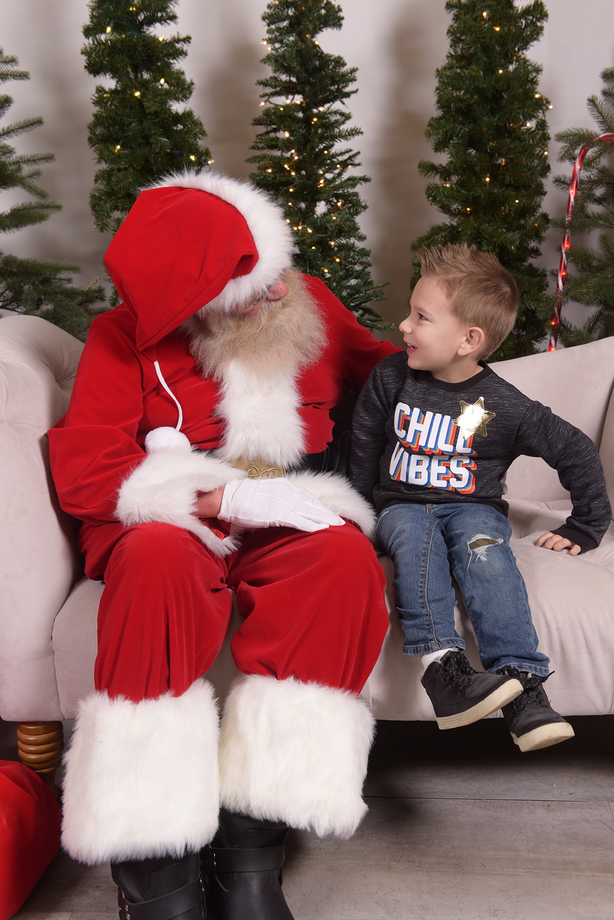 Child sitting with Santa Claus at Christmas