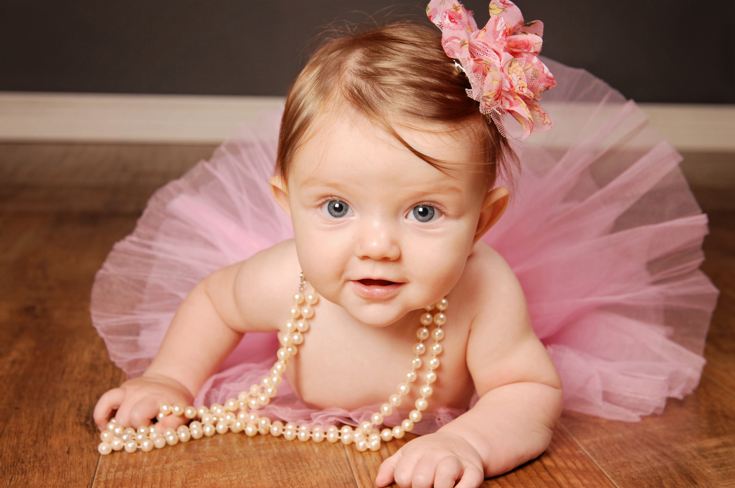 Baby girl in pink tutu with pearls