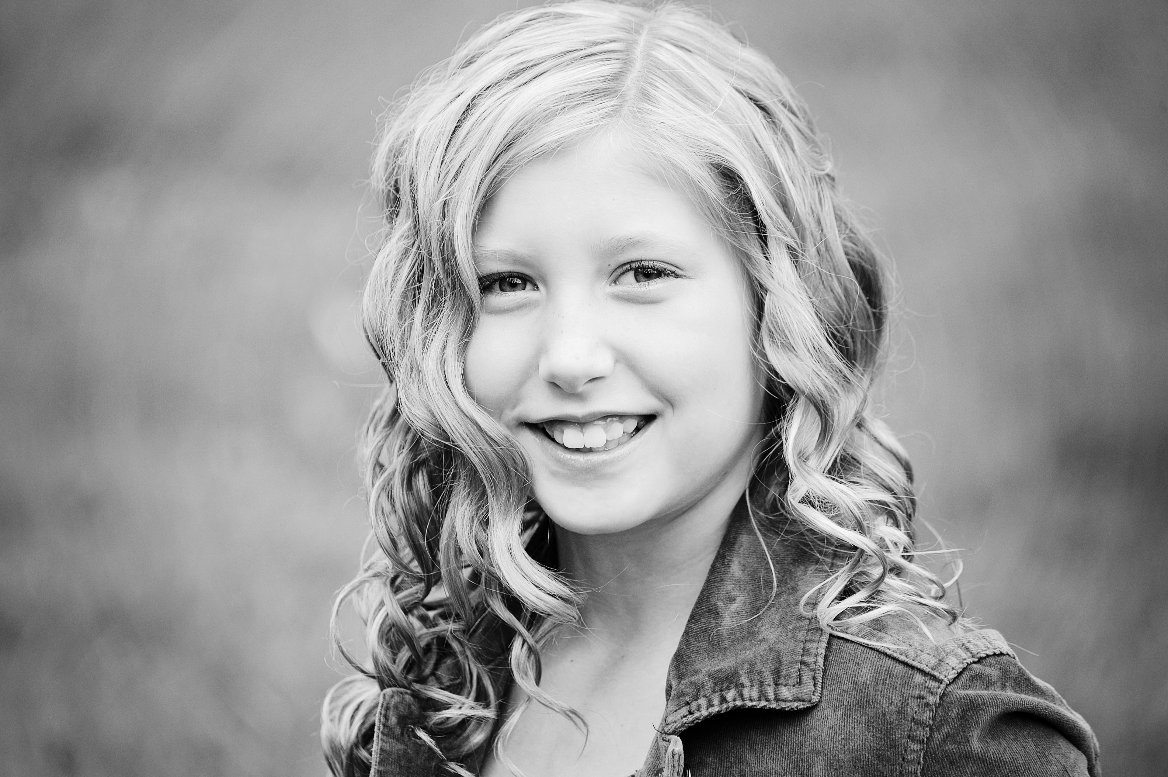 Young girl smiling portrait black and white